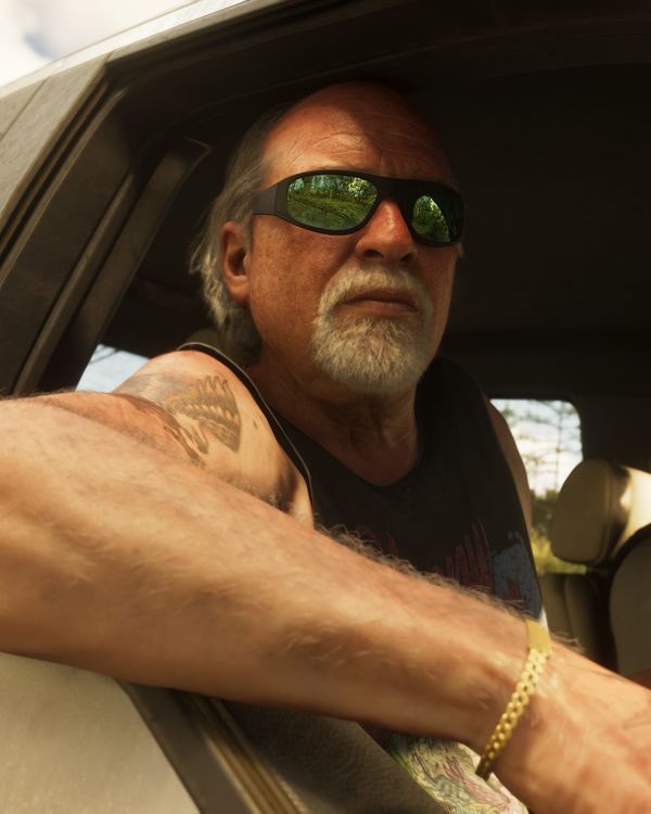 Brian Heder in sunglasses, leaning out of a truck window