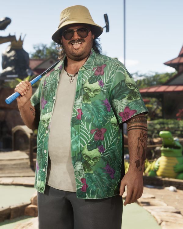 Cal Hampton in a bucket hat and palm-print shirt at a mini golf course