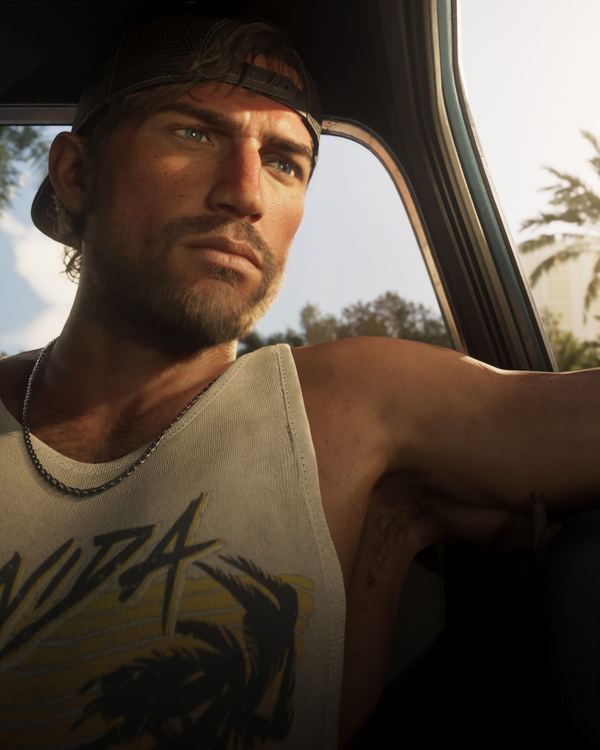 Jason Duval at the wheel of a car, looking out of the window