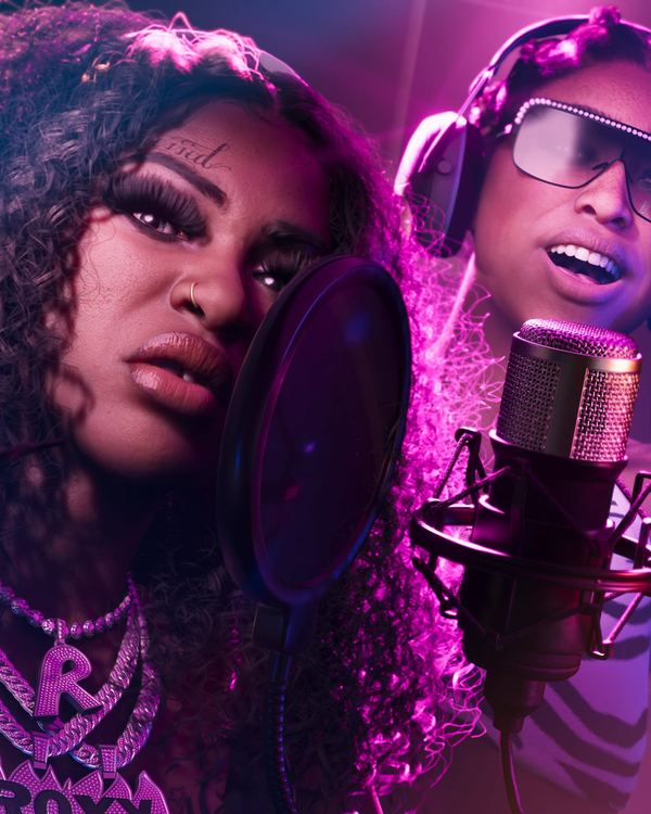 Bae-Luxe and Roxy of the Real Dimez in a recording booth